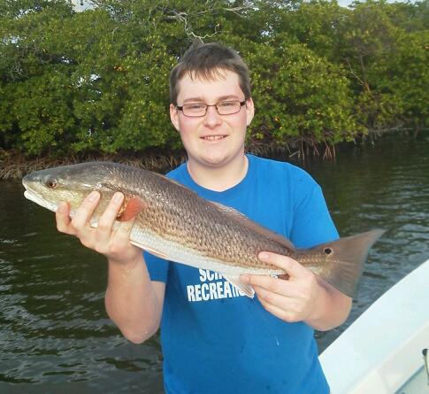 Young angler Rich with one of several beautiful redfish he released on an afternoon half day trip.  1/21/2013