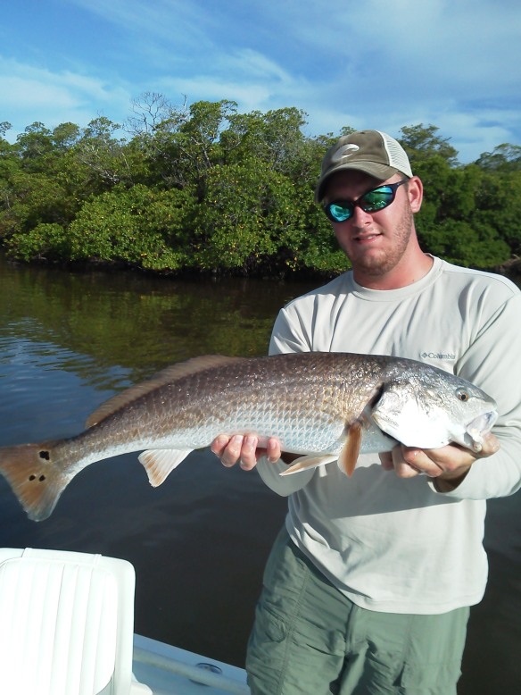 Ben Geroy with a hefty 30 inch redfish before release