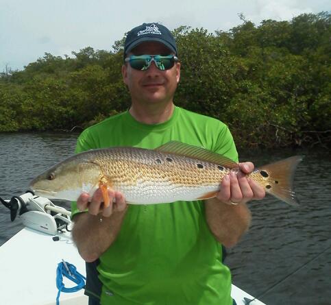 John Schnurbush with a nice multi-spotted redfish before release with Capt. Todd Geroy July 2013