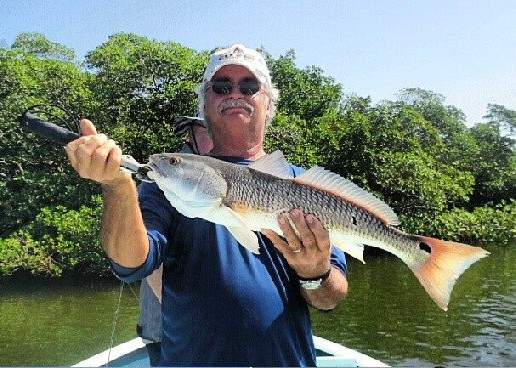 Another redfish comes to the boat at the Naples Take a Soldier Fishing Tournament with Capt. Ben Geroy