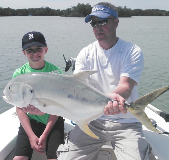 Mike helps Nick with a giant jack crevalle!