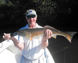 Whit Harvey with an over slot redfish released on 10/20/15. 